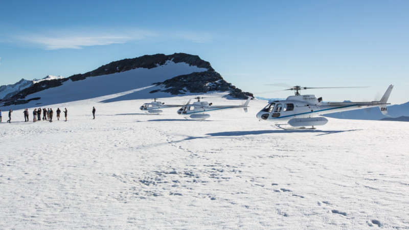 Fly across the clear blue waters of Lake Wanaka, cross over the Southern Alps main divide where you will see the soaring high peaks of Mount Aspiring National Park and multiple spectacular glaciers above native NZ forest.